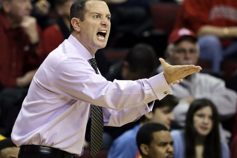 FILE - In this Feb. 9, 2013, file photo, Rutgers coach Mike Rice shouts from the sidelines...