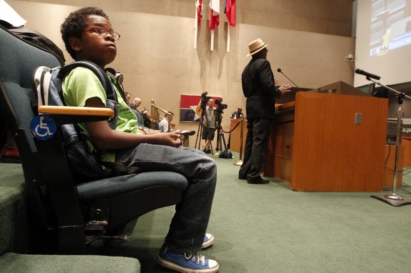 David Williams, 12, waits for his turn to speak at a Dallas City Council meeting. He...