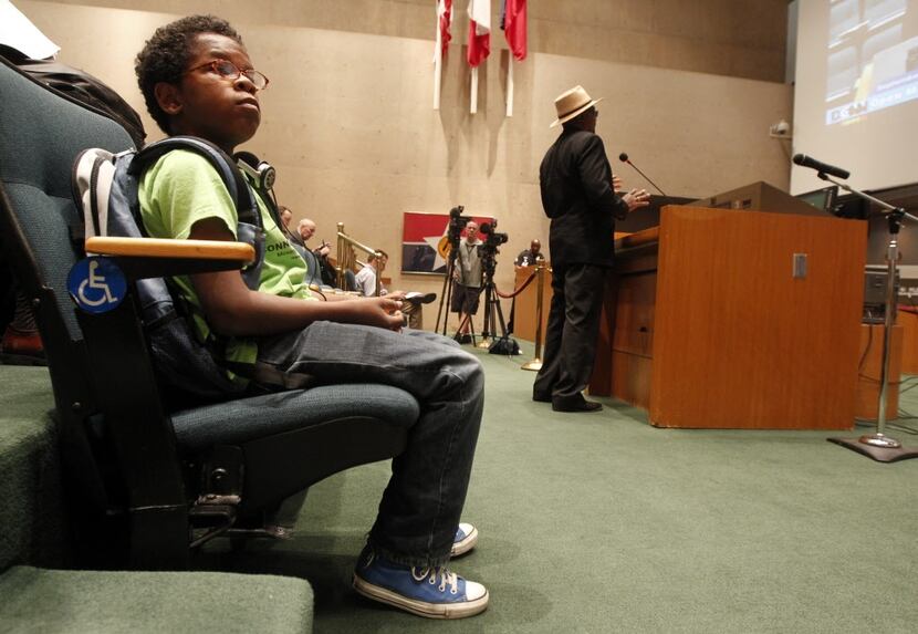 David Williams, 12, waits for his turn to speak at a Dallas City Council meeting. He...