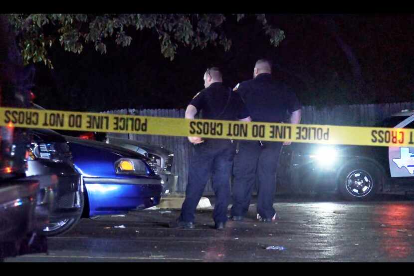 Duncanville police officers investigate the scene near where a shooting took place Tuesday...
