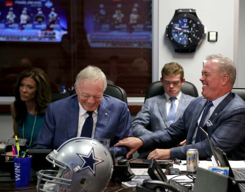 Dallas Cowboys owner Jerry Jones and Executive Vice President/COO Stephen Jones talk in the...