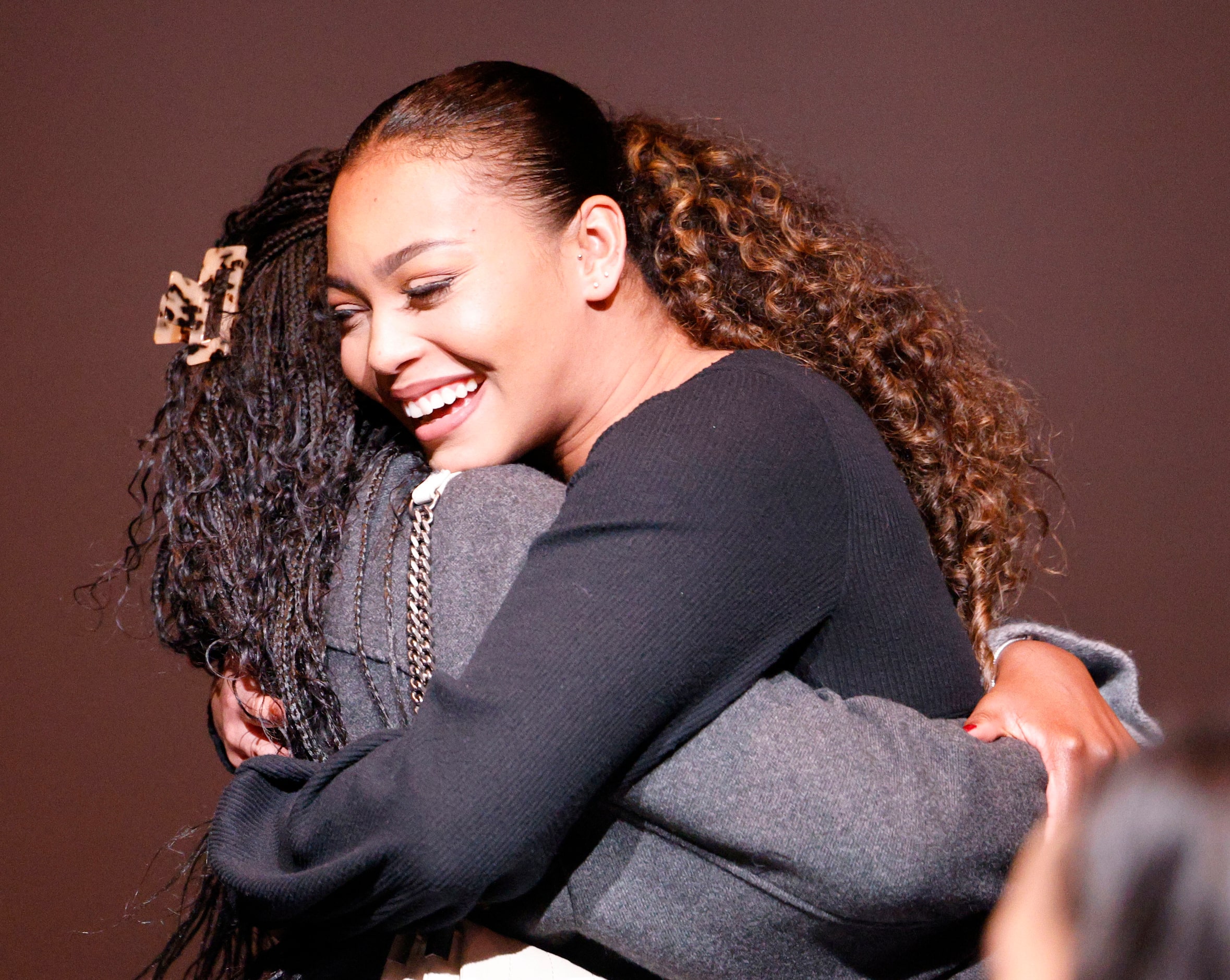 Former Dallas Black Dance Theatre dancer Gillian Clifford receives a hug, Wednesday, Dec....