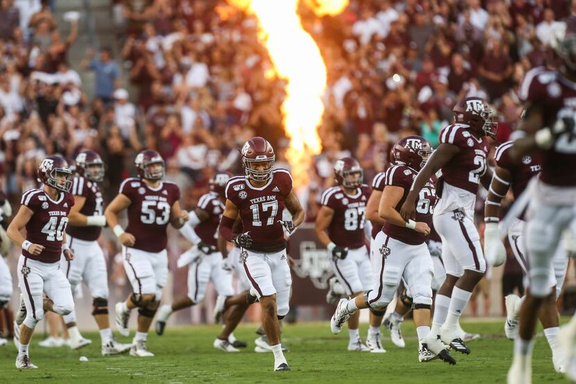 The Texas A&M Aggies break onto the field prior to a college football game between Texas A&M...