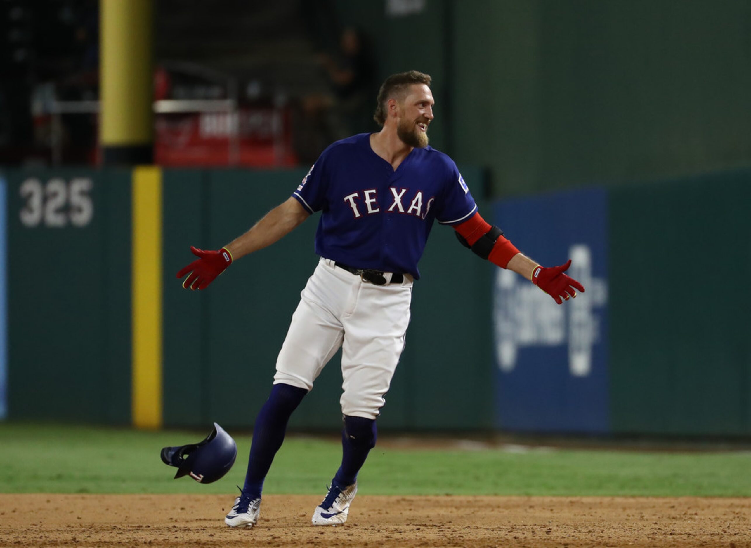 ARLINGTON, TEXAS - AUGUST 21:  Hunter Pence #24 of the Texas Rangers celebrates a walk off...