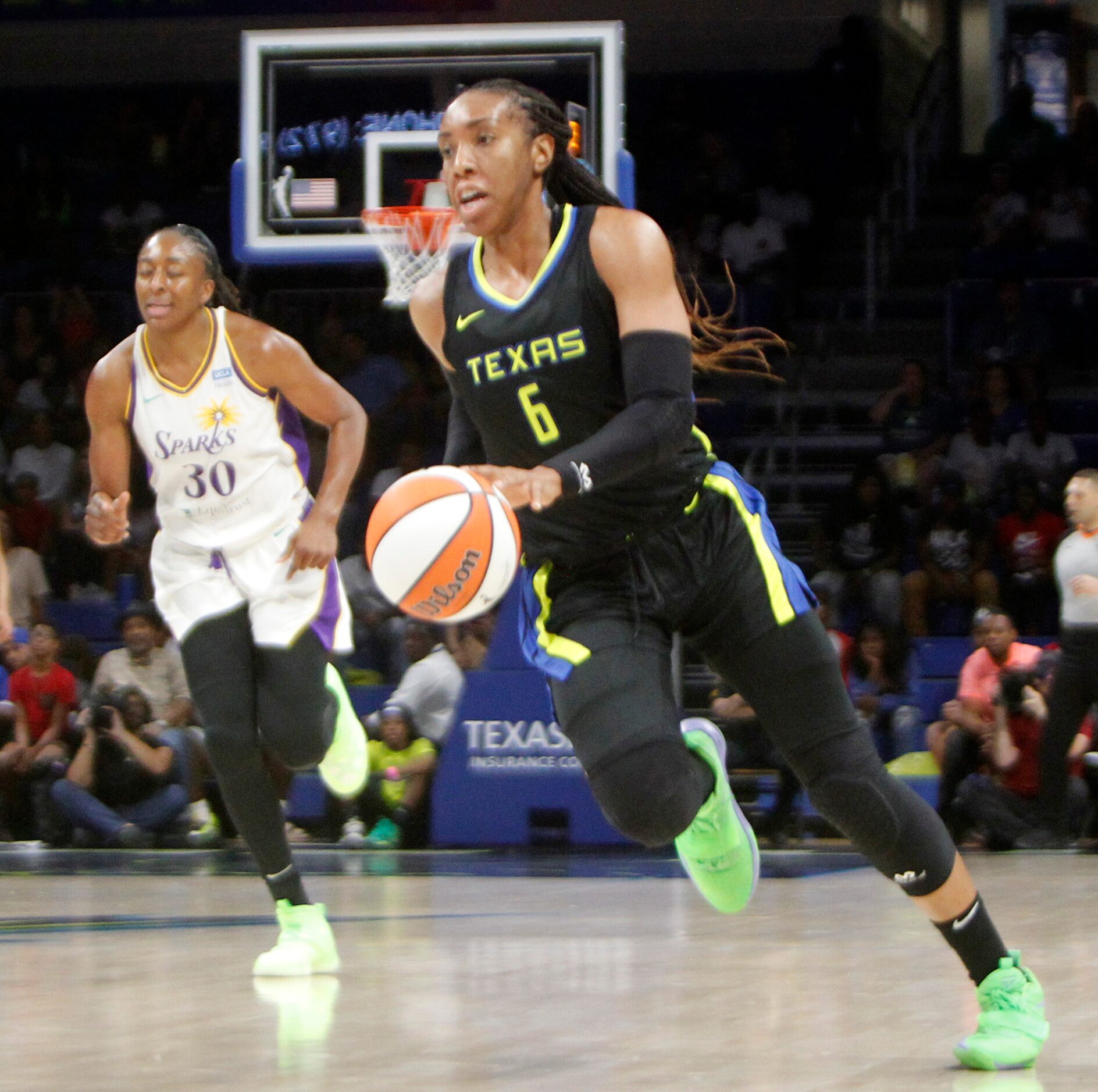 Dallas Wings forward Kayla Thornton (6) races to the basket during a first half fast break...