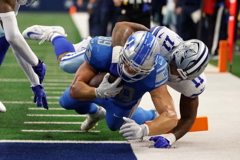 Detroit Lions tight end Brock Wright (89) is tackled at the 1-yard line by Dallas Cowboys...