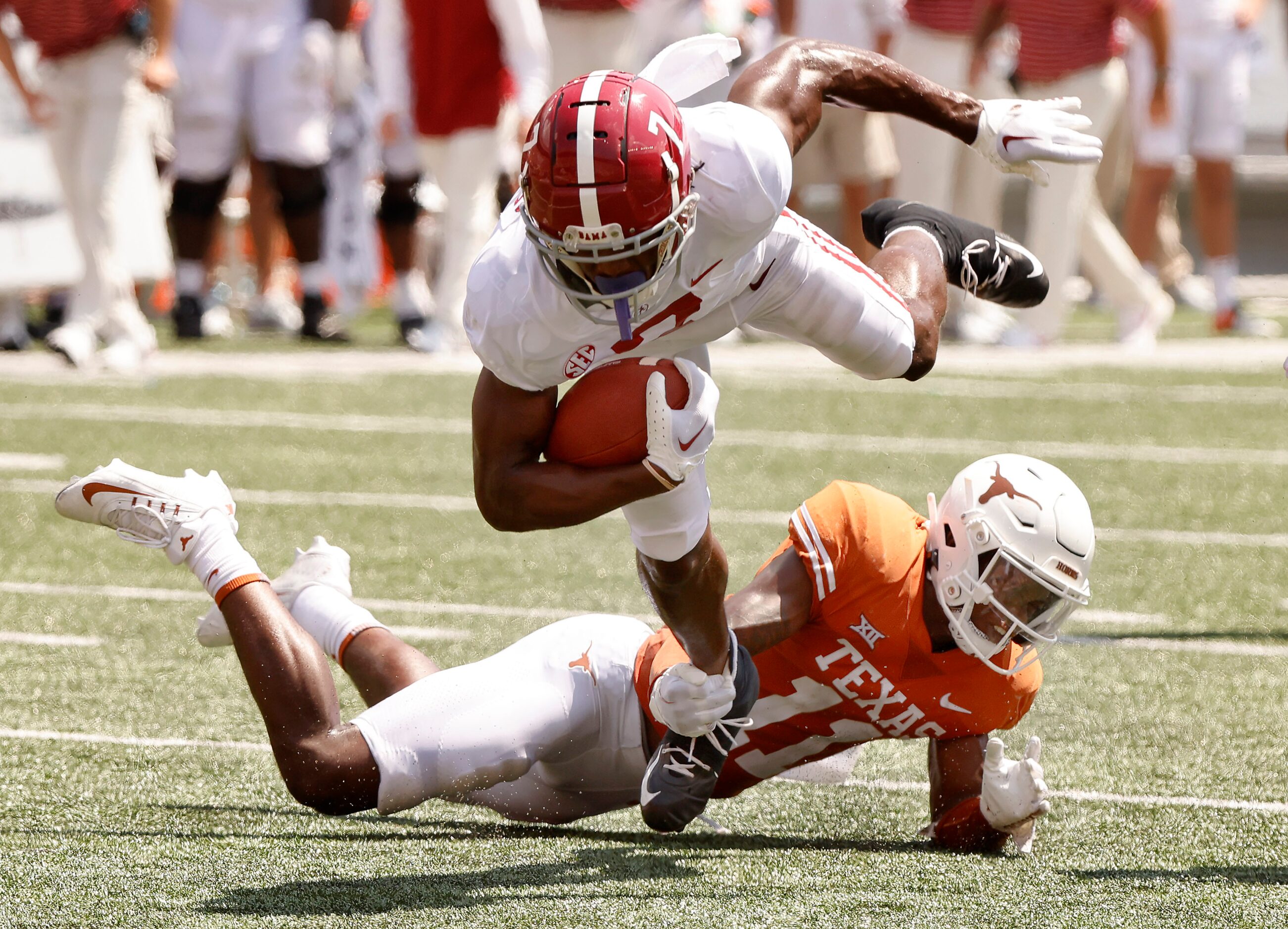 Texas Longhorns defensive back Anthony Cook (11) trips up Alabama Crimson Tide wide receiver...