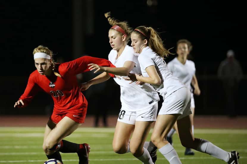 Flower Mound Marcus's Taylor Moon (20) moves the ball against Trophy Club Byron Nelson's...