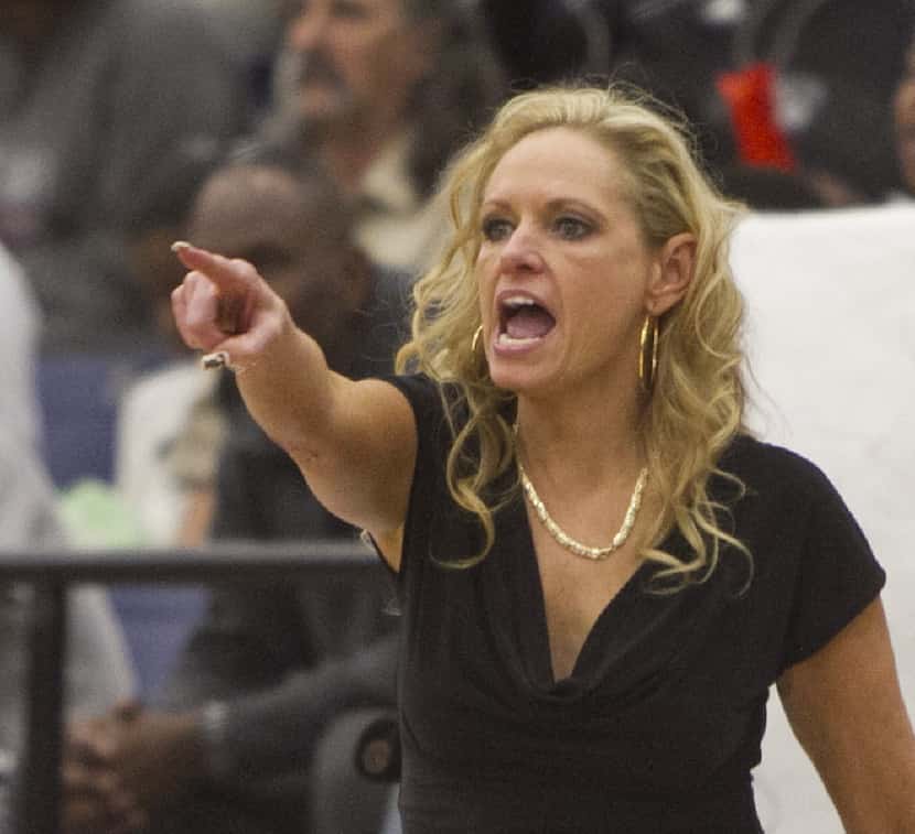 Mansfield Timberview head coach Kit Kyle Martin directs her players during first half action...