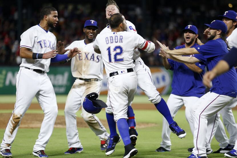 Texas Rangers second baseman Rougned Odor (12) celebrates with teammates after hitting a...