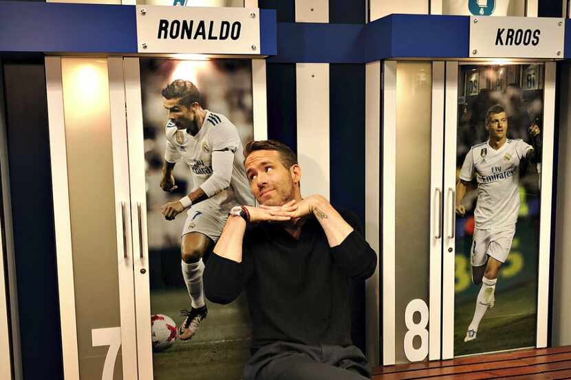 Deadpool star Ryan Reynolds poses in front of Cristiano Ronaldo's locker at the Santiago...