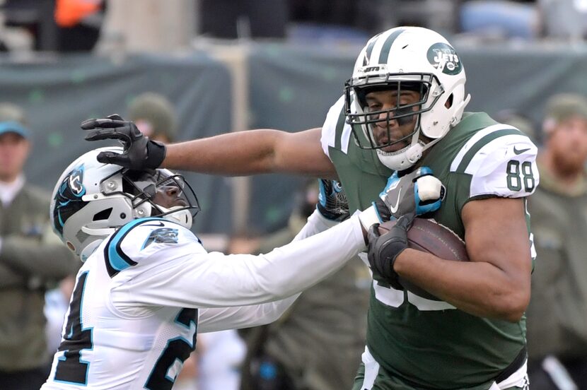 Carolina Panthers cornerback James Bradberry (24) attempts to tackle New York Jets tight end...