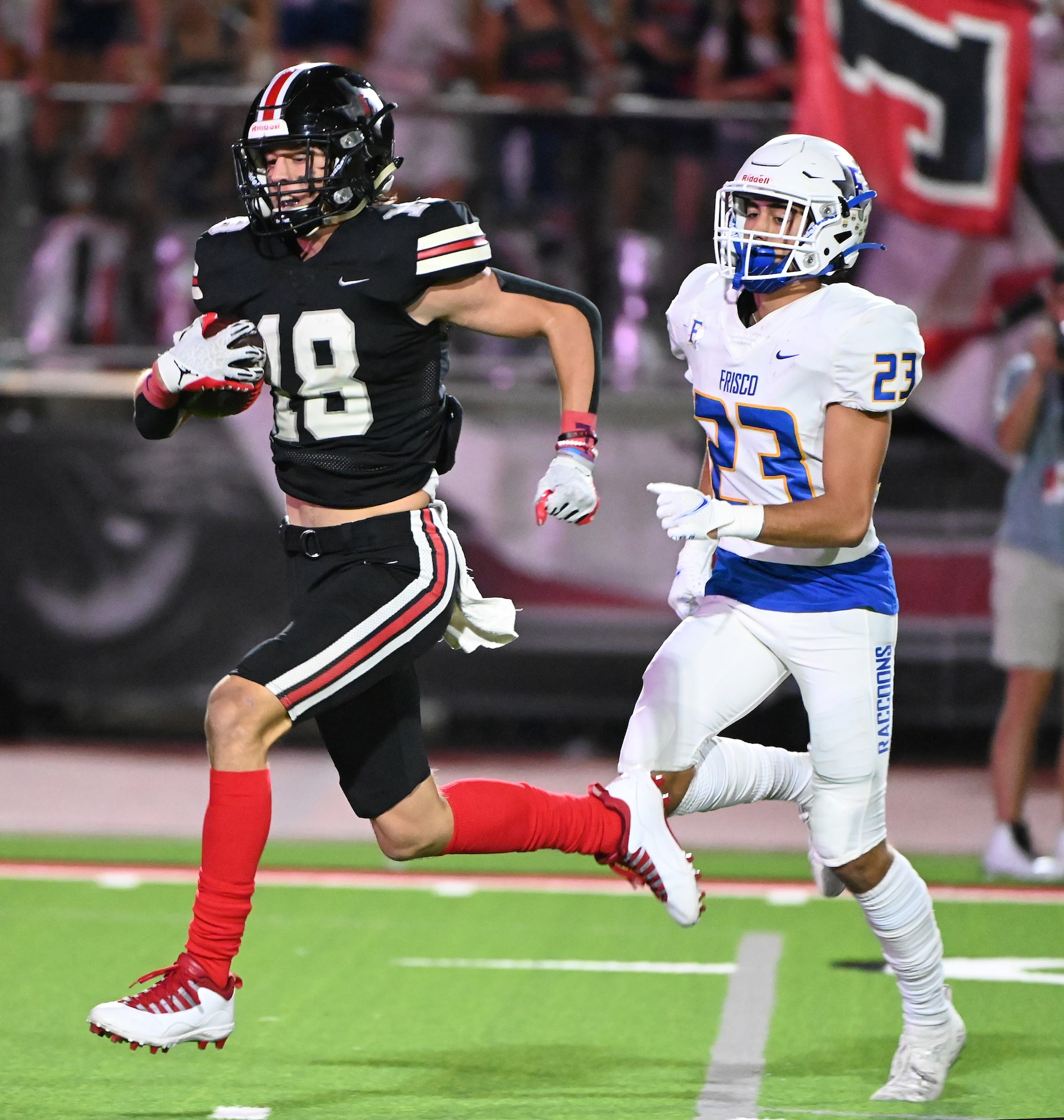 Lovejoy's Parker Livingstone (18) runs past Frisco's Drew Johnson (23) for a touchdown in...