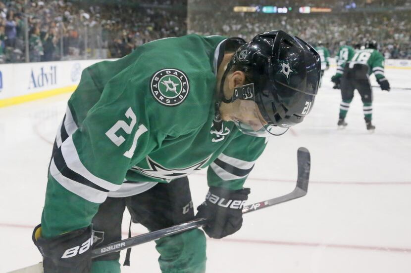 Dallas Stars left wing Antoine Roussel (21) skates away dejectedly after the Stars lose 5-4...