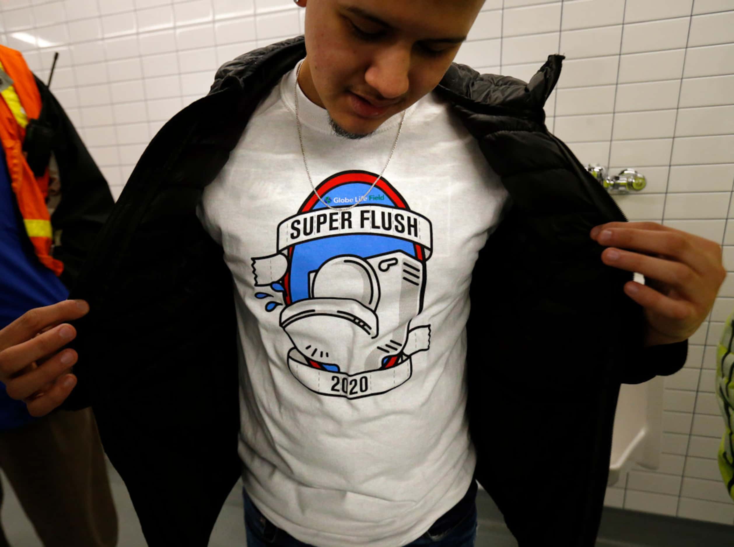 A high school student shows off his Super Flush t-shirt before a mass flushing of toilets...