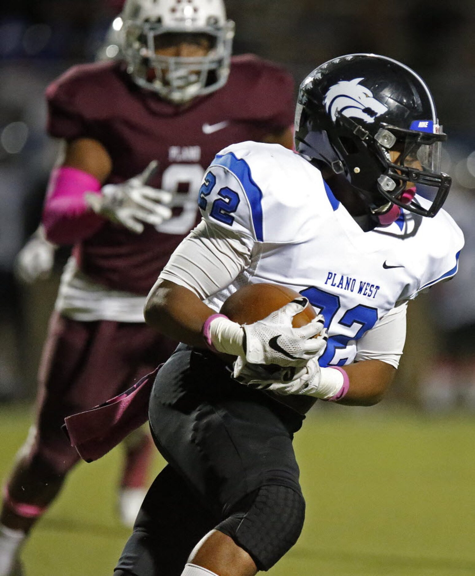 Plano West High School running back J.D. Manigan (22) carries the football in the first...