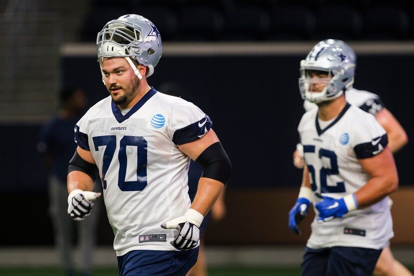 Dallas Cowboys offensive guard Zack Martin (70) and offensive guard Connor Williams (52) run...