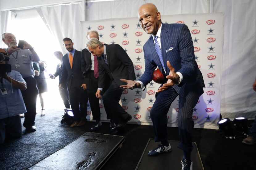 Dallas Cowboys Drew Pearson assumes the position from the "Hail Mary," catch while standing...
