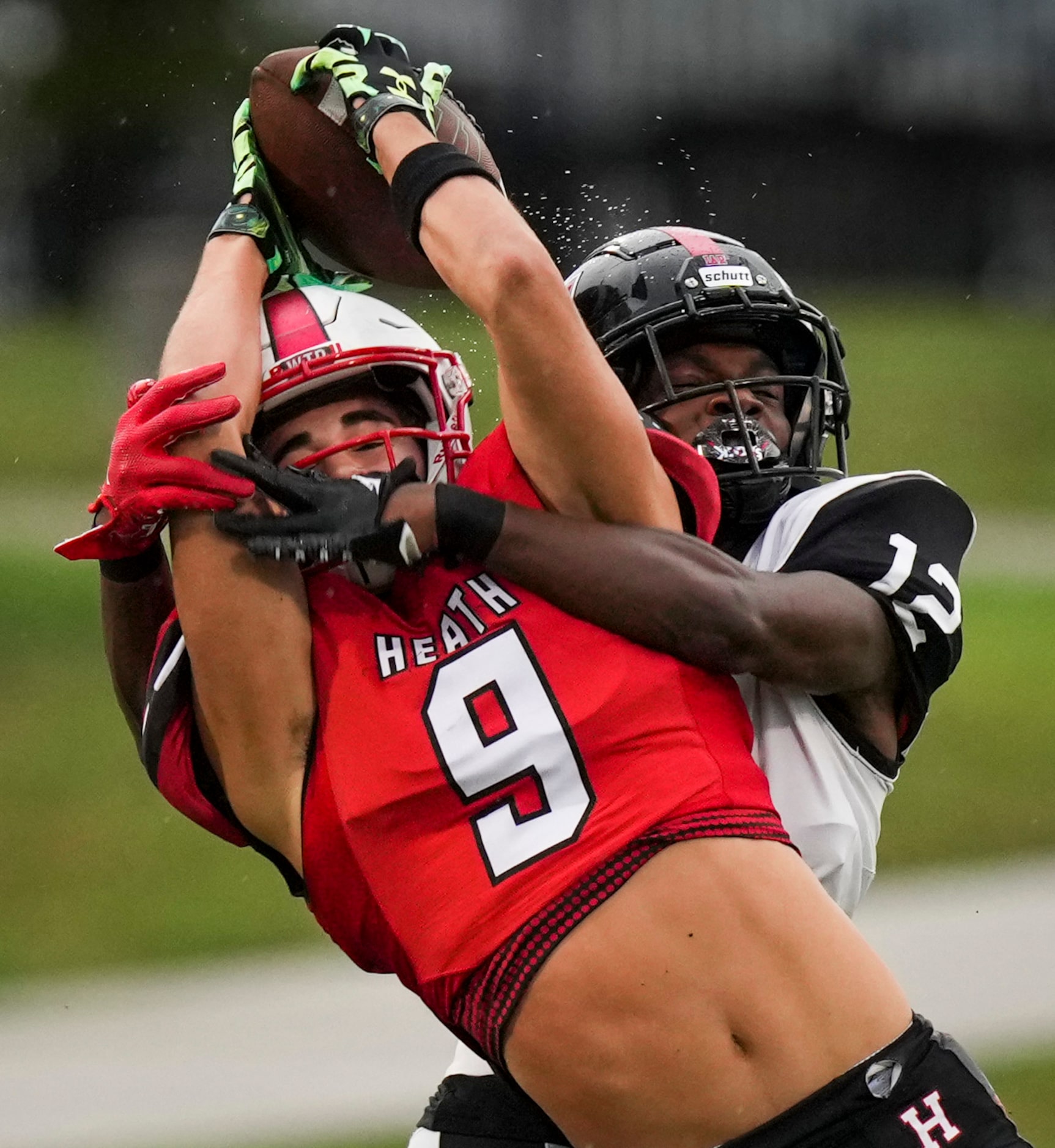 Euless Trinity defensive back Lamont Potts (12) breaks up a pass intended for Rockwall-Heath...