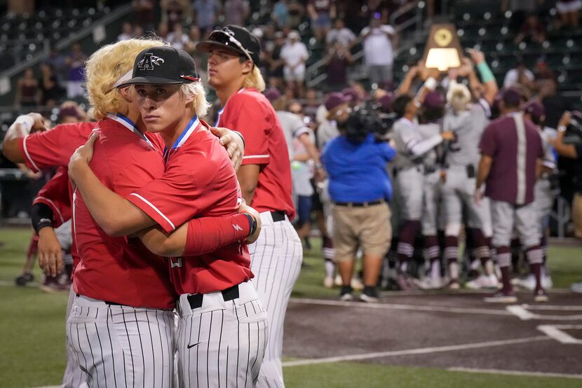 Argyle first baseman Alex D'Angelo (2) hugs teammate Jacob Gregory (59) as Sinton players...