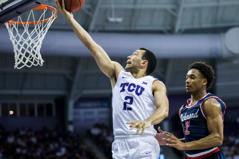 TCU Horned Frogs guard Michael Williams (2) goes up for a shot ahead of Richmond Spiders...