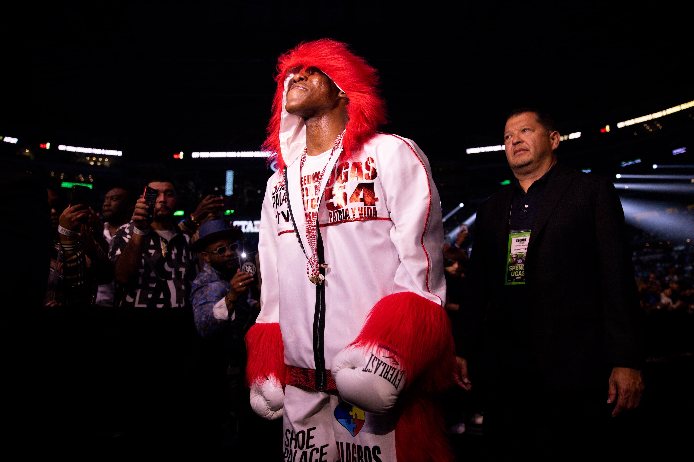 Yordenis Uga walks to the ring before welterweight championship boxing match against...