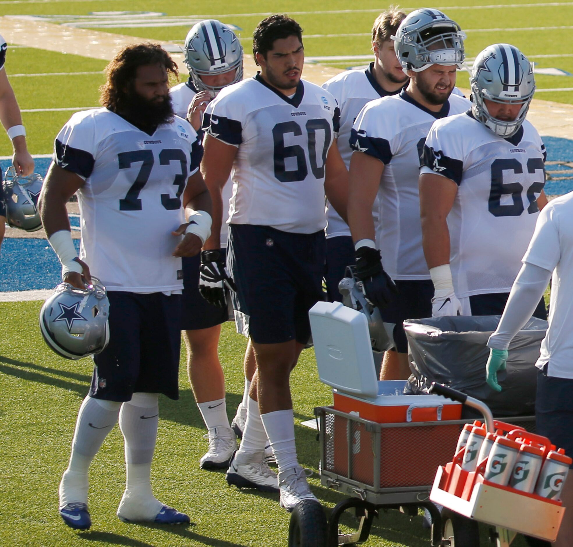 Dallas Cowboys offensive tackle Isaac Alarcn (60) and Dallas Cowboys center Joe Looney (73)...