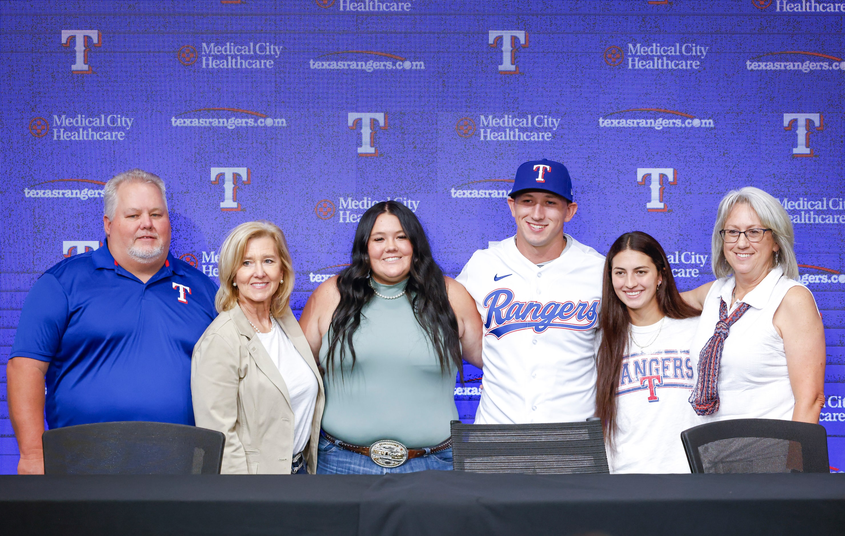 Texas Rangers top pick Wyatt Langford (third from right) poses for a portrait with his...