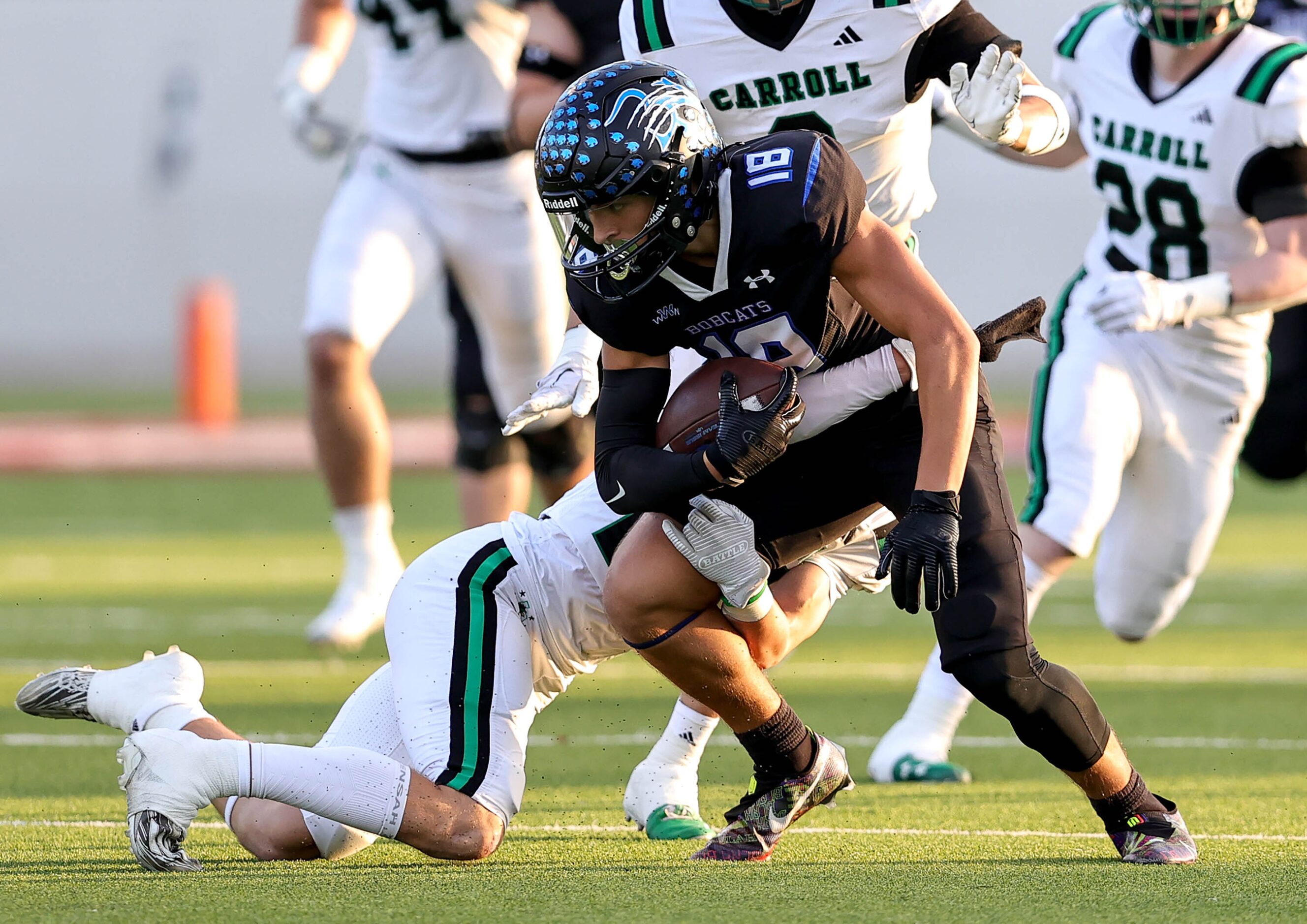 Byron Nelson wide receiver Ezra Malamura (18) comes up with a reception and is brought down...