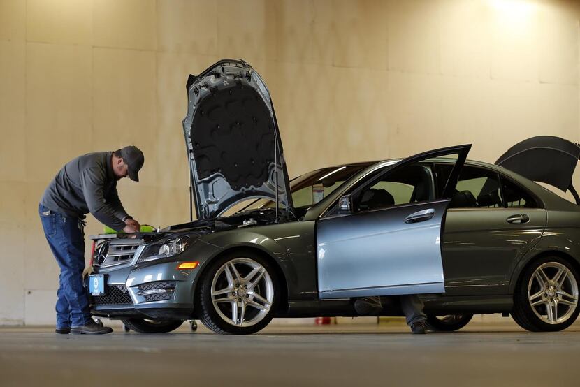 
Beepi specialists inspect a 2012 Mercedes-Benz before delivery. 
