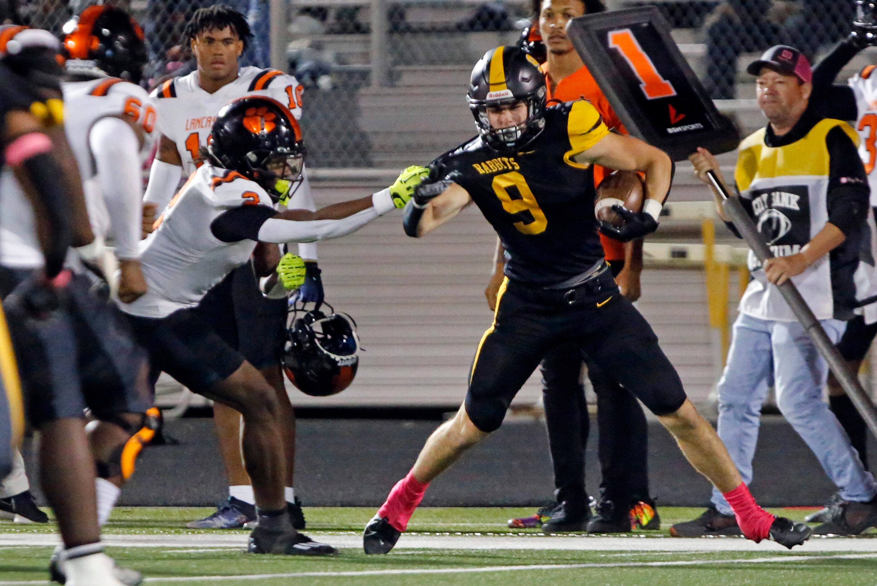 Forney high defender Seth Hyder (9) intercepts a pass, as Lancaster high’s Kewan Lacy (2)...