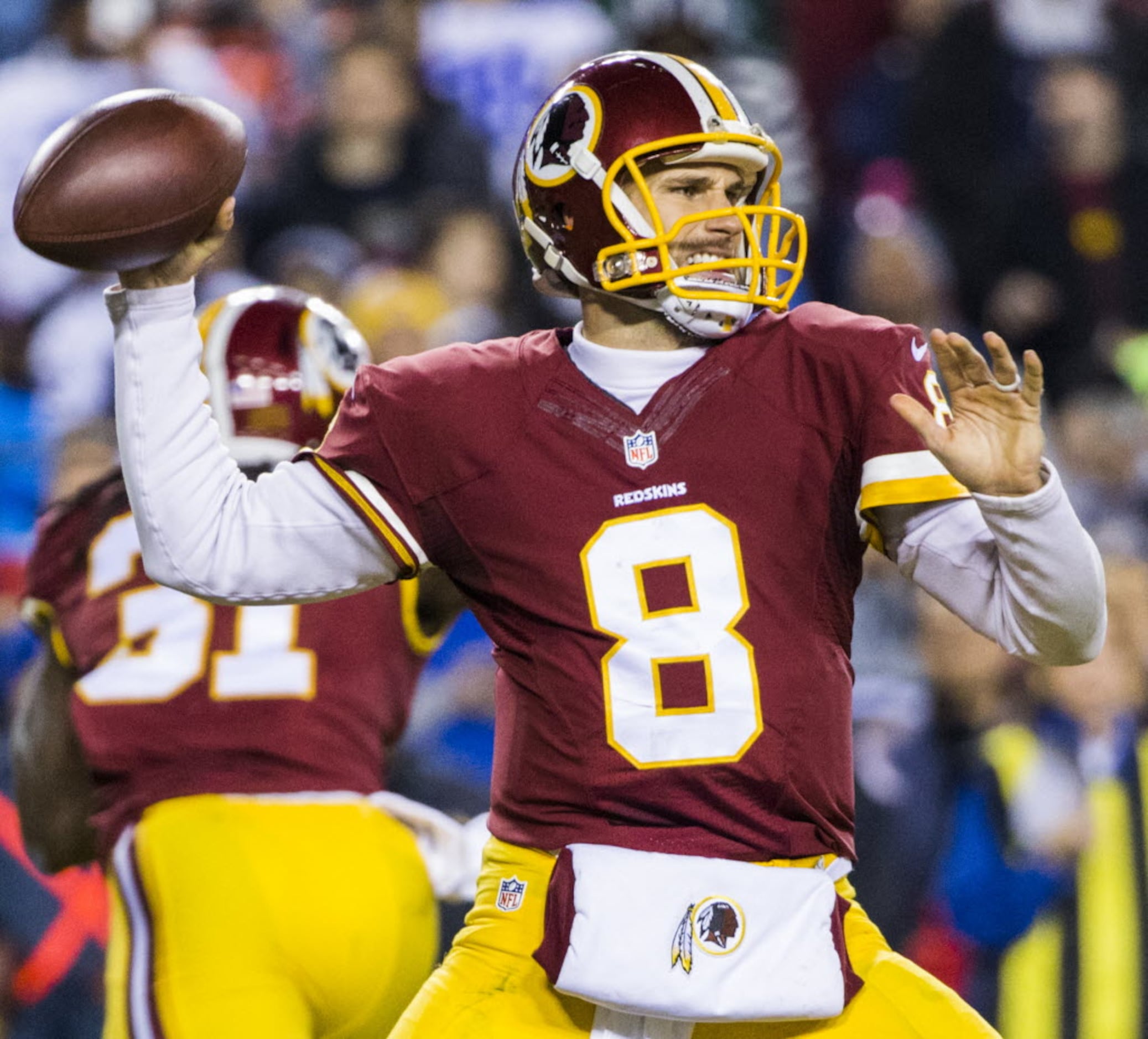 Washington Redskins quarterback Kirk Cousins (8) looks for wide