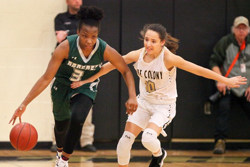 Proper post Jordyn Oliver dribbles down the court while defended by The Colony gaurd Hannah...
