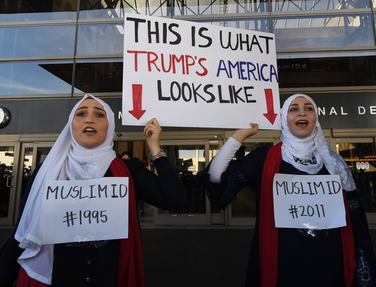 Noor Hindi (L) and Sham Najjar (R) who were born in the US of Syrian parents, demonstrate...