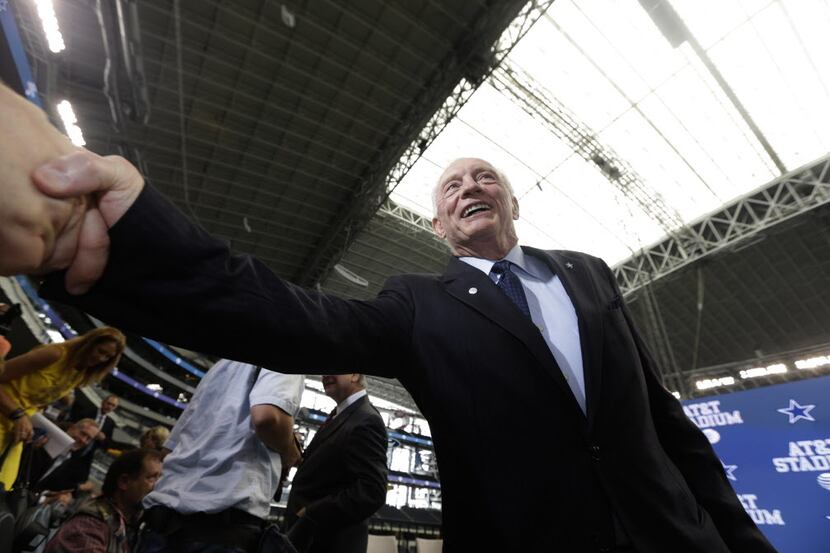 Dallas Cowboys owner Jerry Jones shakes hands after a news conference announcing the naming...