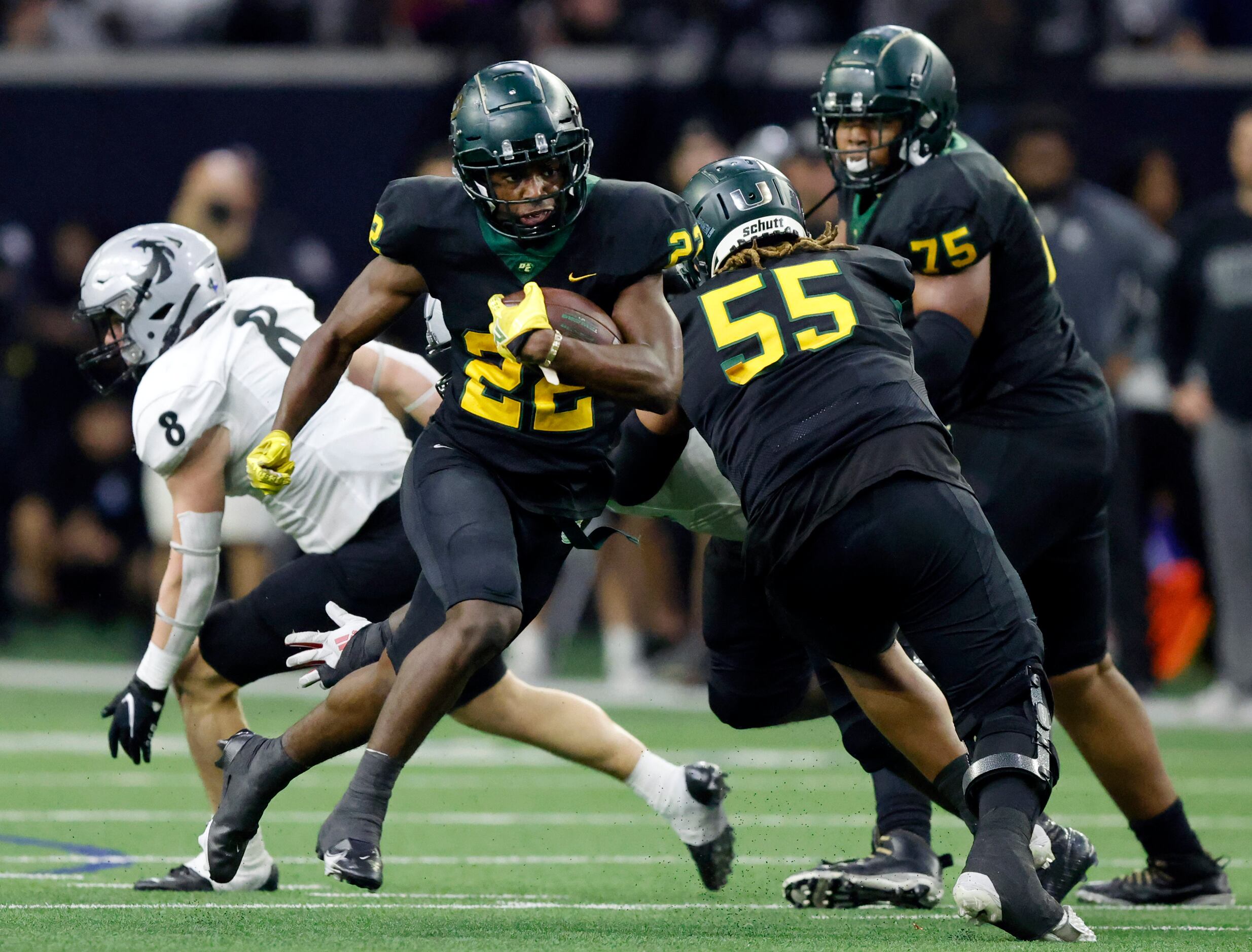 DeSoto running back Deondrae Riden Jr. (22) finds a hole in the Denton Guyer defense during...