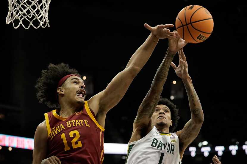 Iowa State forward Robert Jones (12) and Baylor guard Keyonte George (1) battle for a...