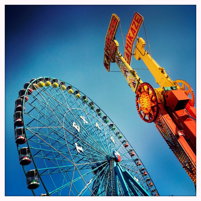 Fairgoers ride the Texas Star ferris wheel during the State Fair of Texas at Fair Park in...