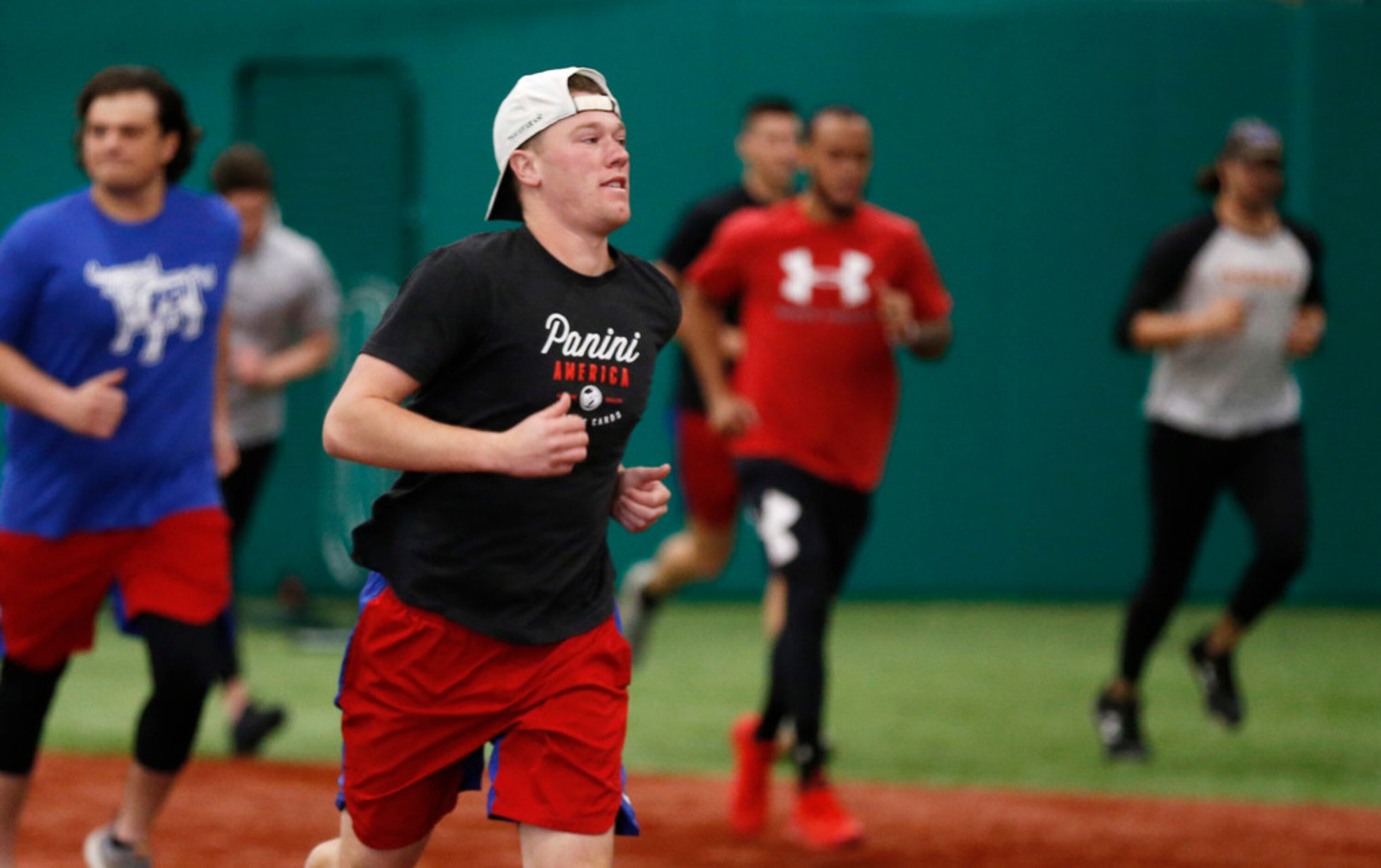 Texas Rangers pitcher Kolby Allard (39) runs as he warms up during the Texas Rangers mini...