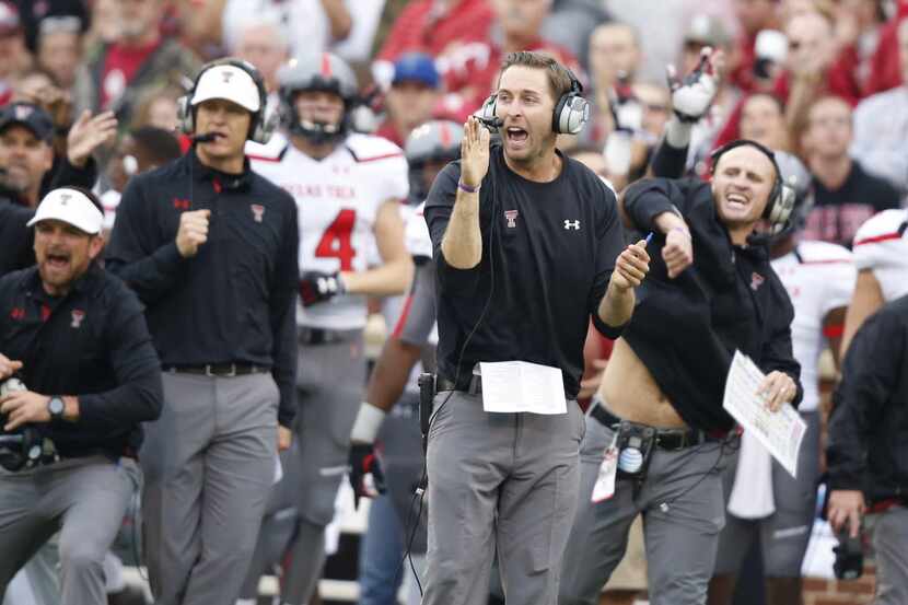 Texas Tech head coach Kliff Kingsbury, center, gestures on the sidelines in the first...