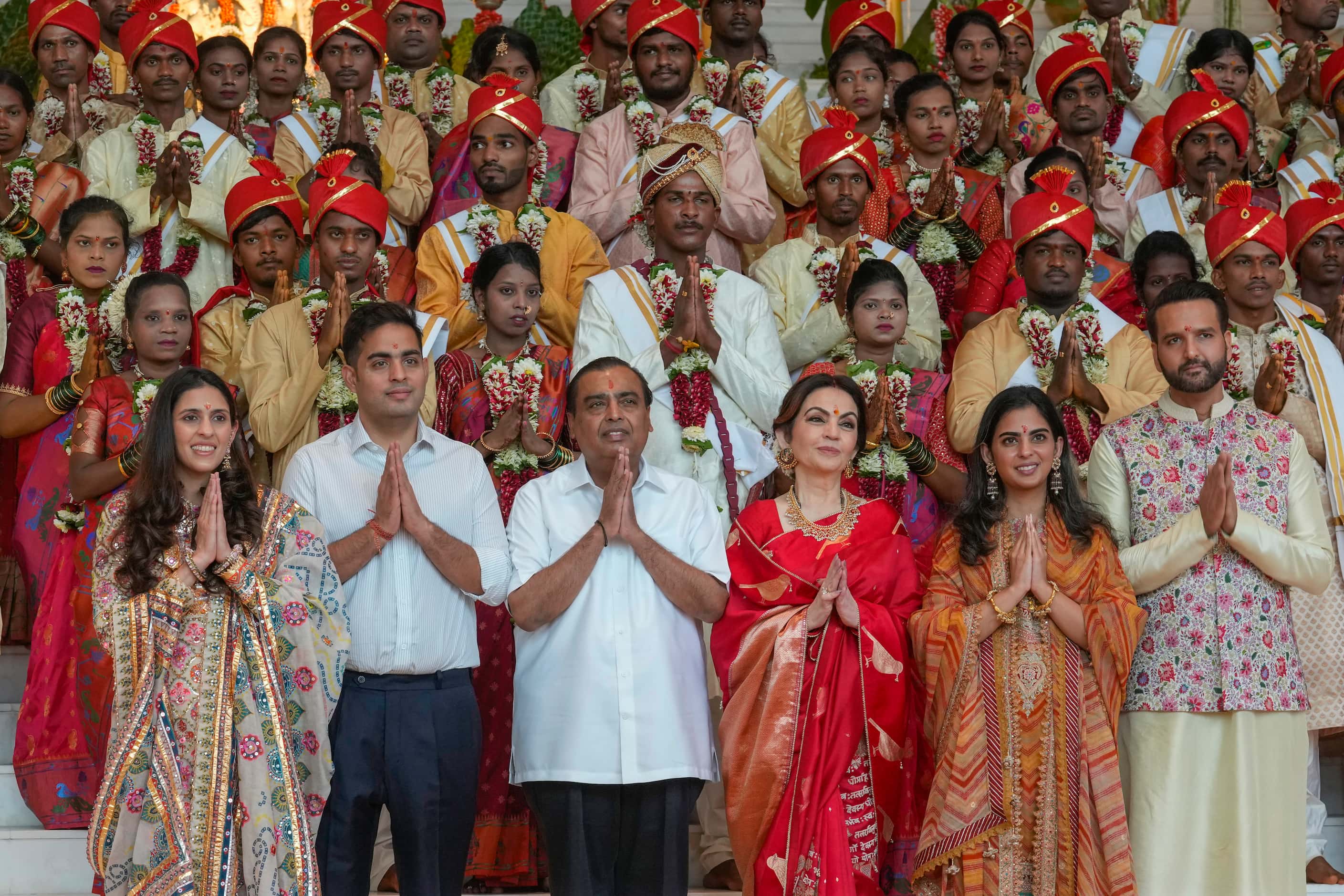 Chairman of Reliance Industries Limited Mukesh Ambani, third from left, with his family...