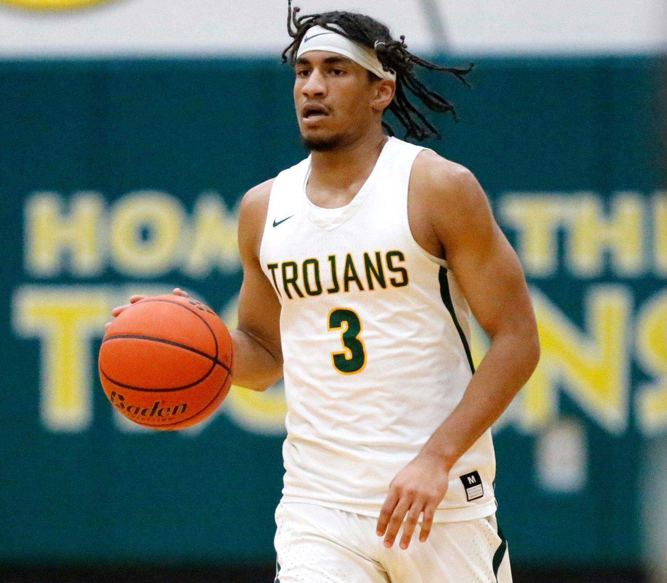 Newman Smith High School forward Jarren Cook (3) brings the basketball down the floor during...