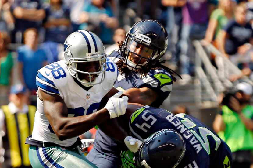 Seattle’s secondary blanketed Dez Bryant with physical play and press coverage, holding him...