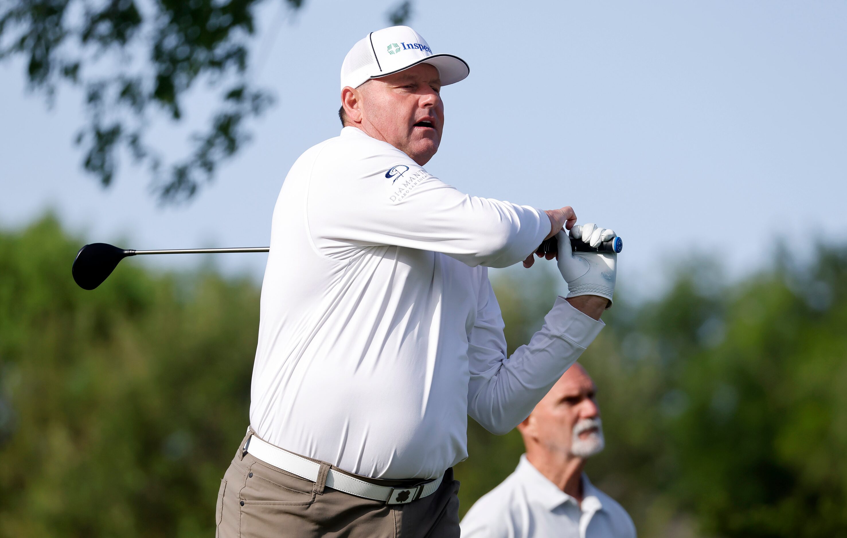 Former Boston Red Sox Hall of Fame pitcher Roger Clemens hits his drive on No. 15 during the...