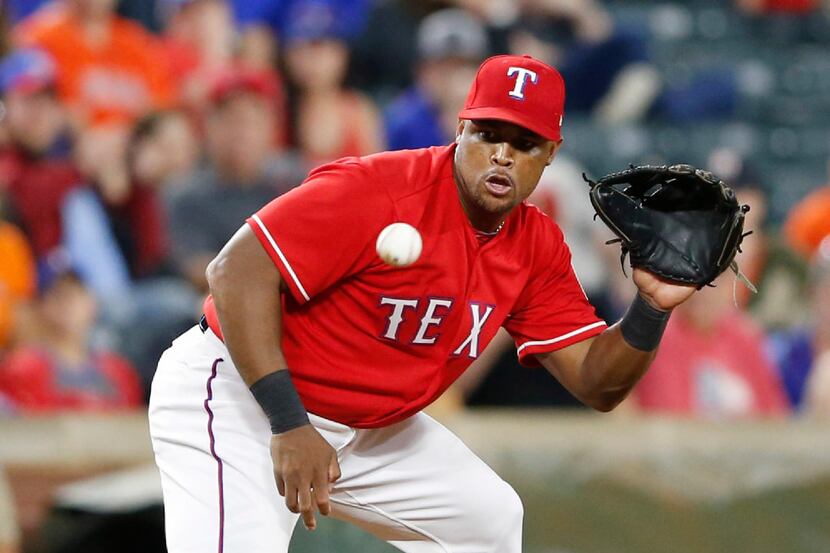 Texas Rangers third baseman Adrian Beltre (29) fields a ball hit by Houston Astros third...