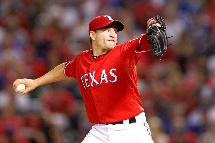 Texas Rangers relief pitcher Jason Frasor (44) throws against the Tampa Bay Rays in the...