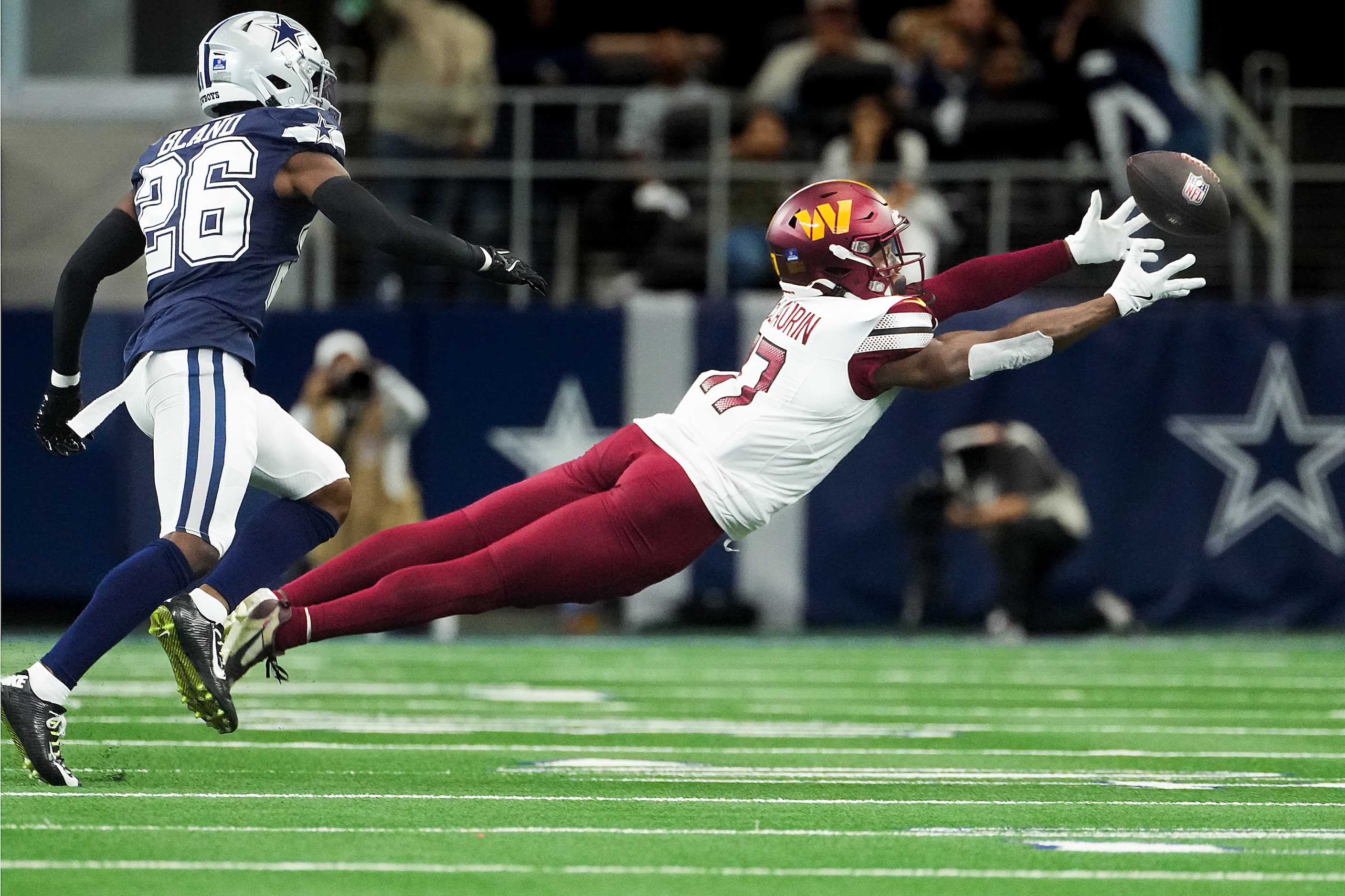 A pass goes off the hands of Washington Commanders wide receiver Terry McLaurin (17) as...