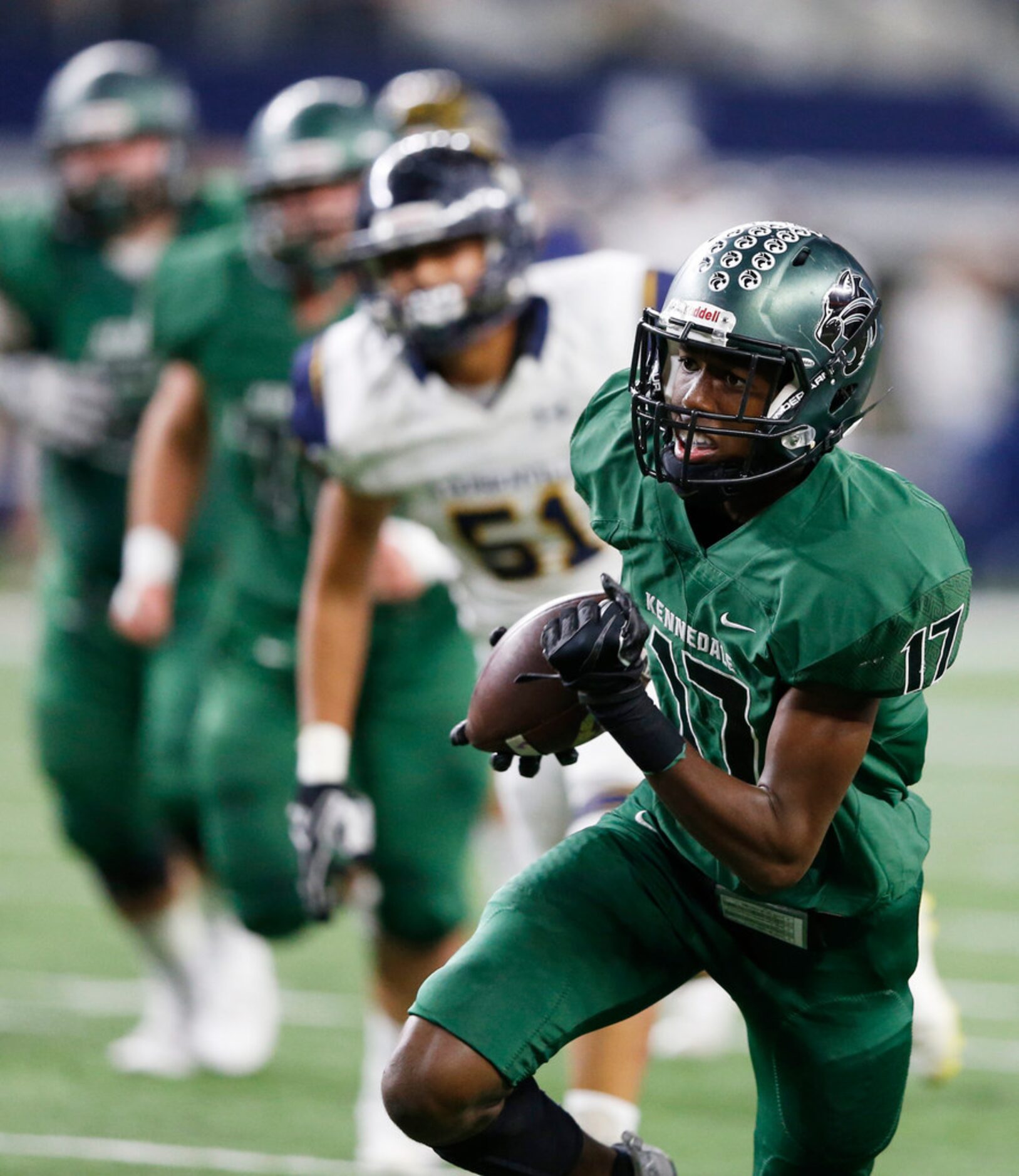 Kennedale's Jaden Smith (17) runs after the catch for a touchdown in a game against...