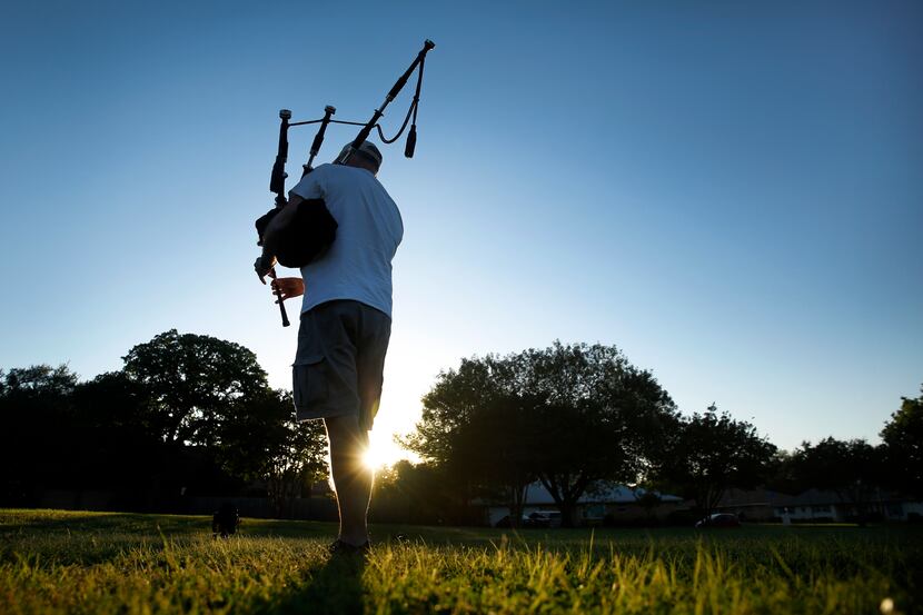 Every day at sunset, Arlington's Tony Hill, along with hundreds of other bagpipers around...