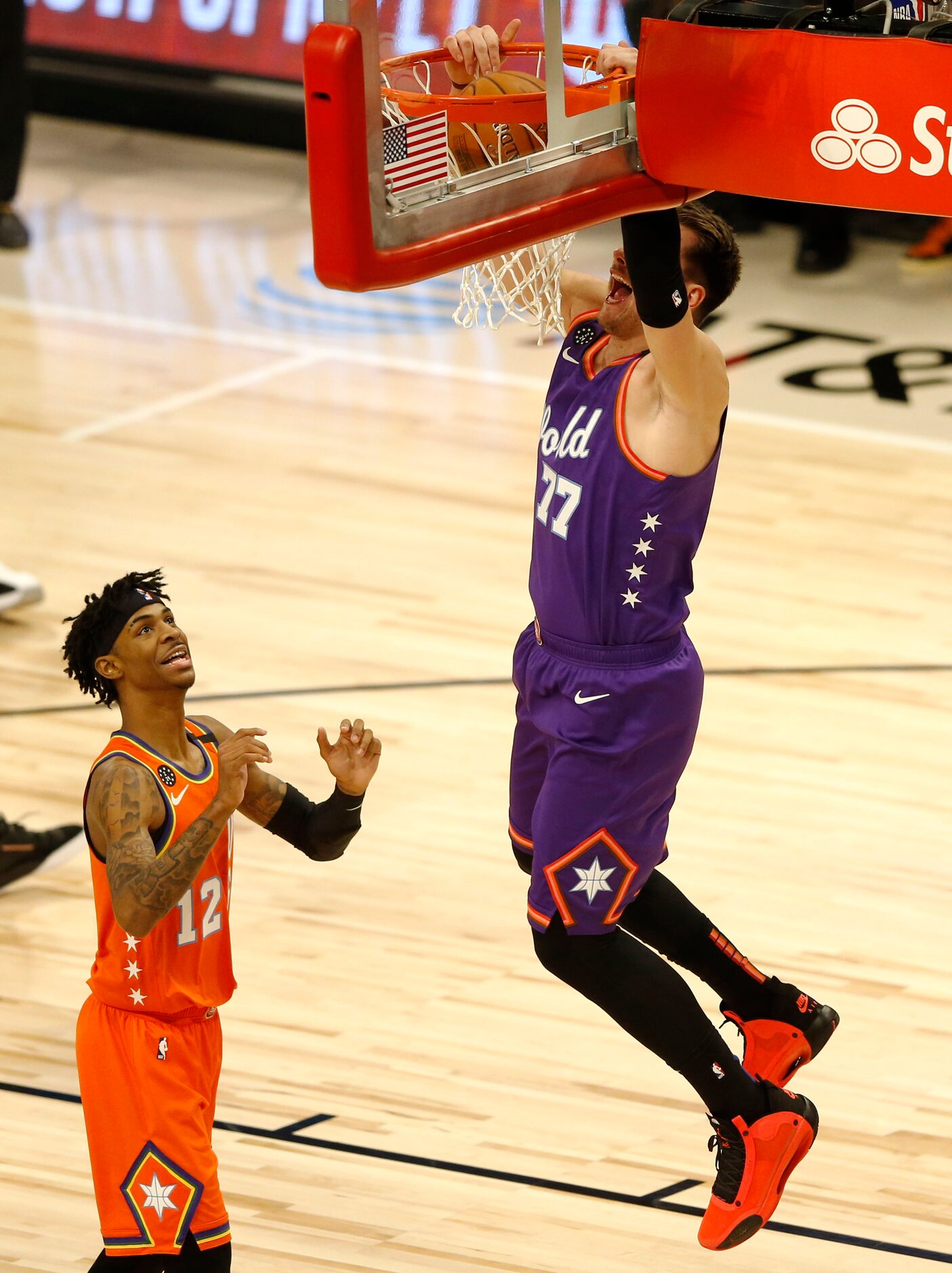 World Team and Dallas Mavericks Luka Doncic (77) goes up for a dunk in a game against USA...